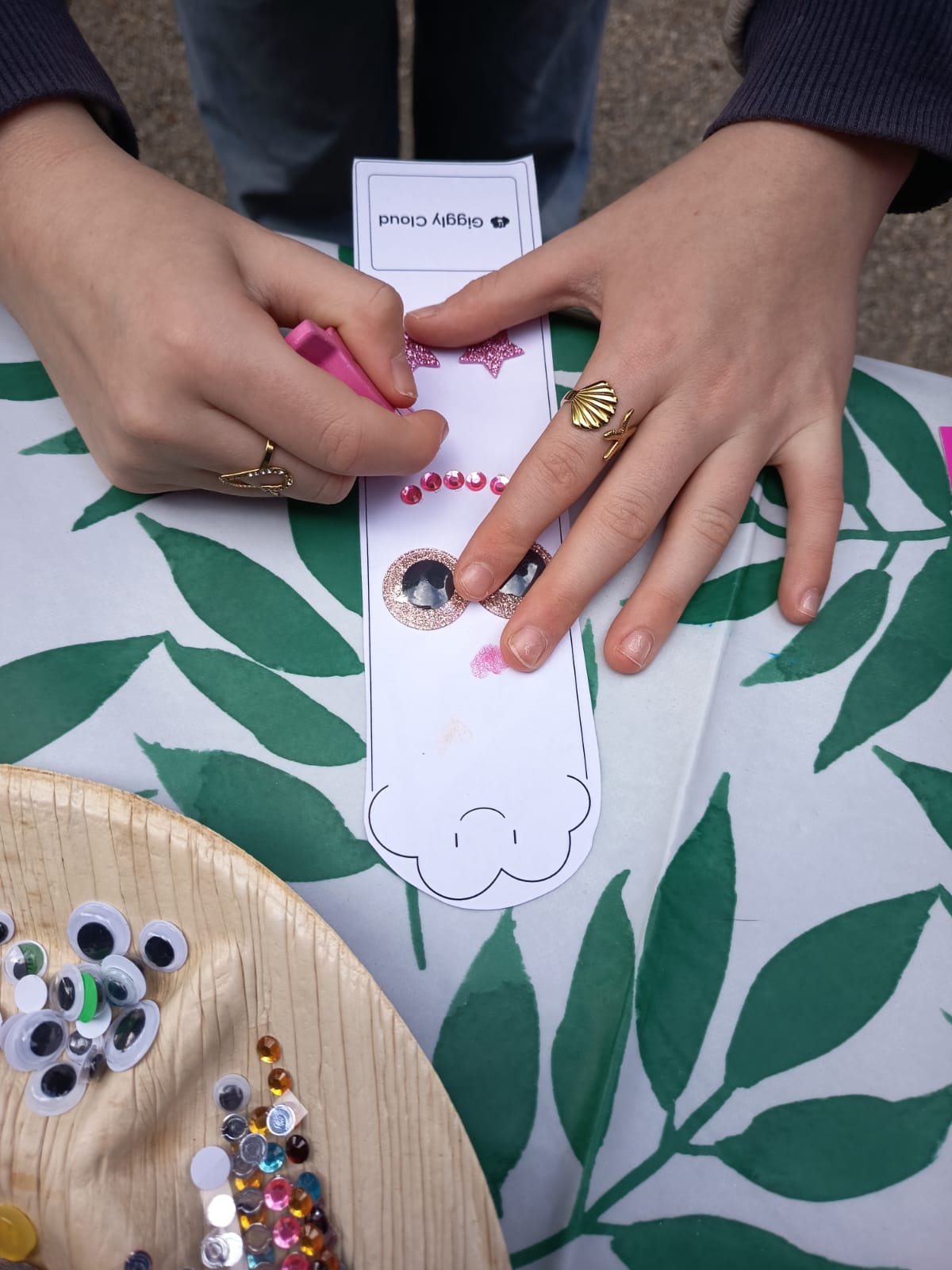 Children decorating bookmarks at the Giggly Cloud book swap.
