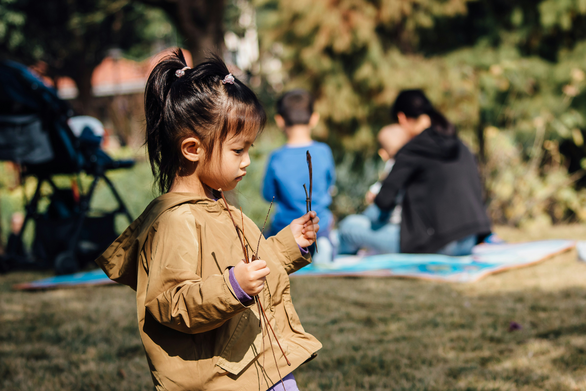 A child exploring nature in the park
